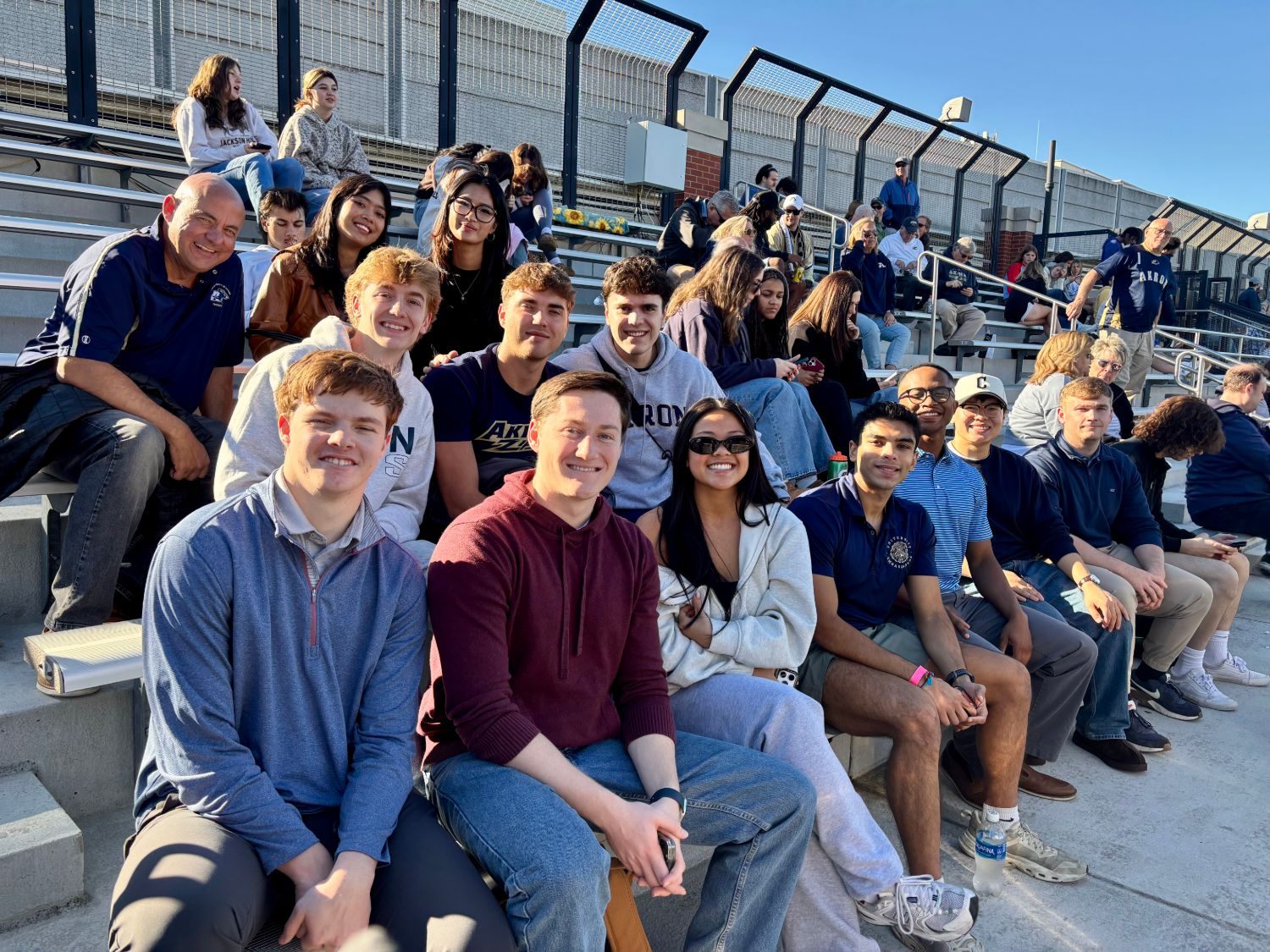 The group in the stands at the UA Men's Soccer match